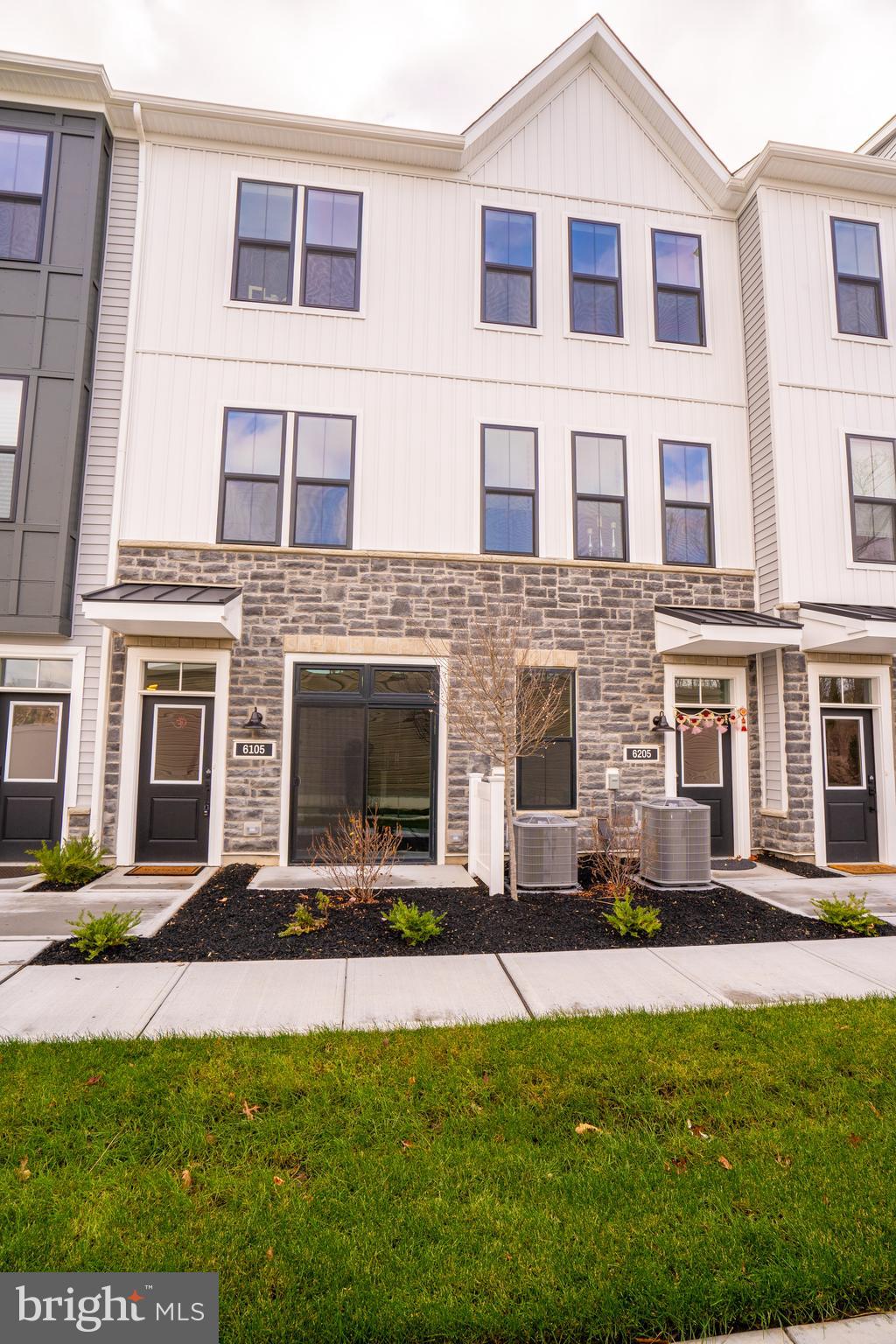 a large building with a yard in front of it