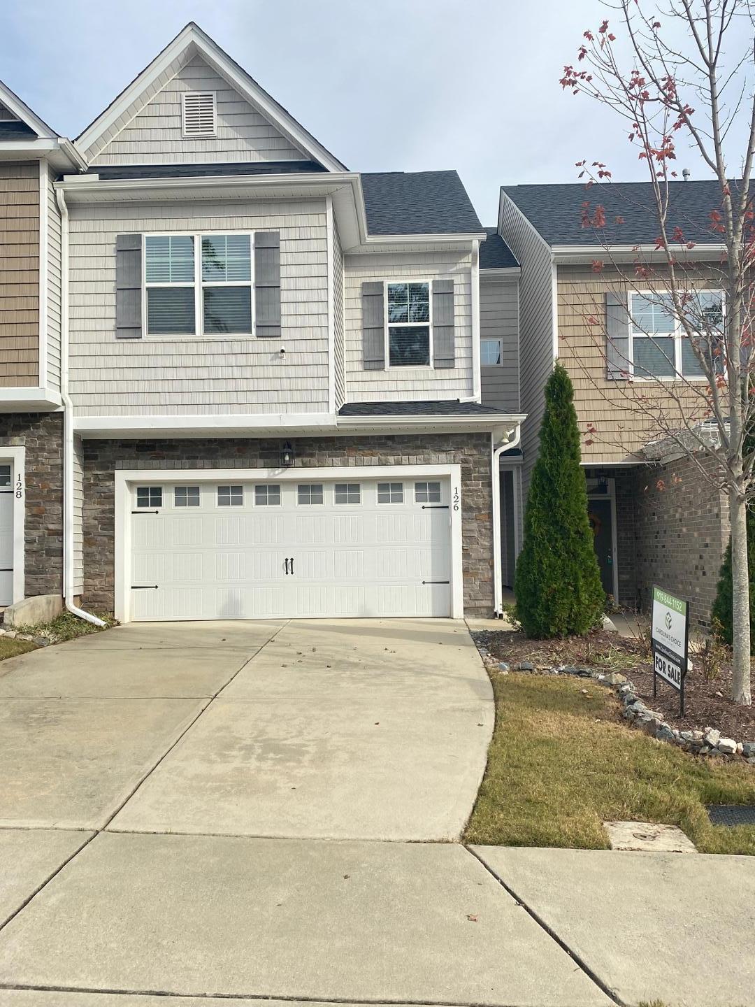 a front view of a house with yard