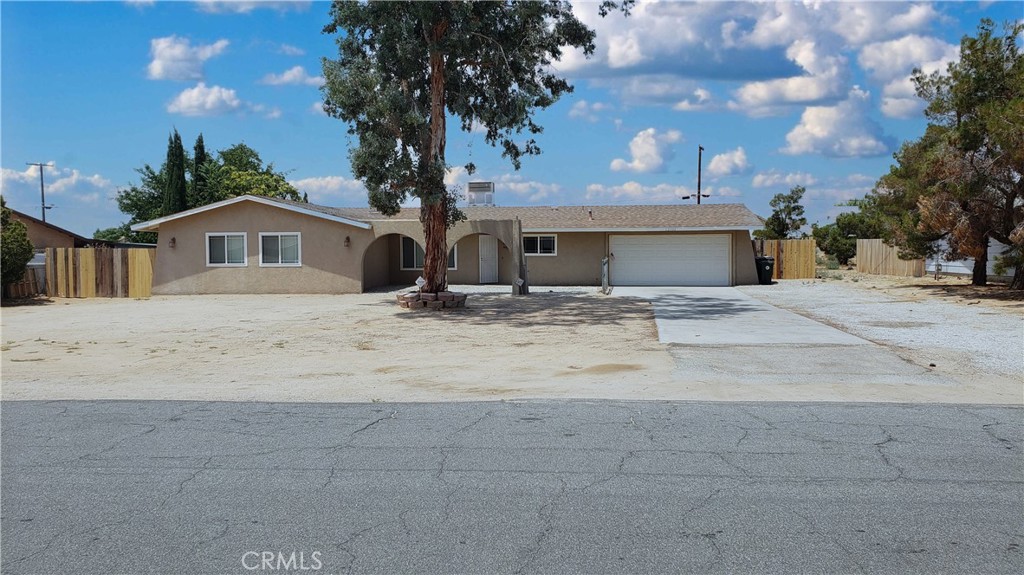 a view of house with a yard