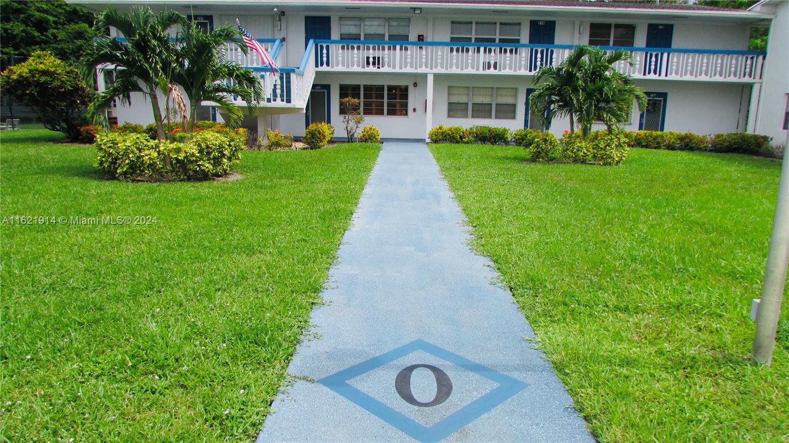 a front view of building with yard