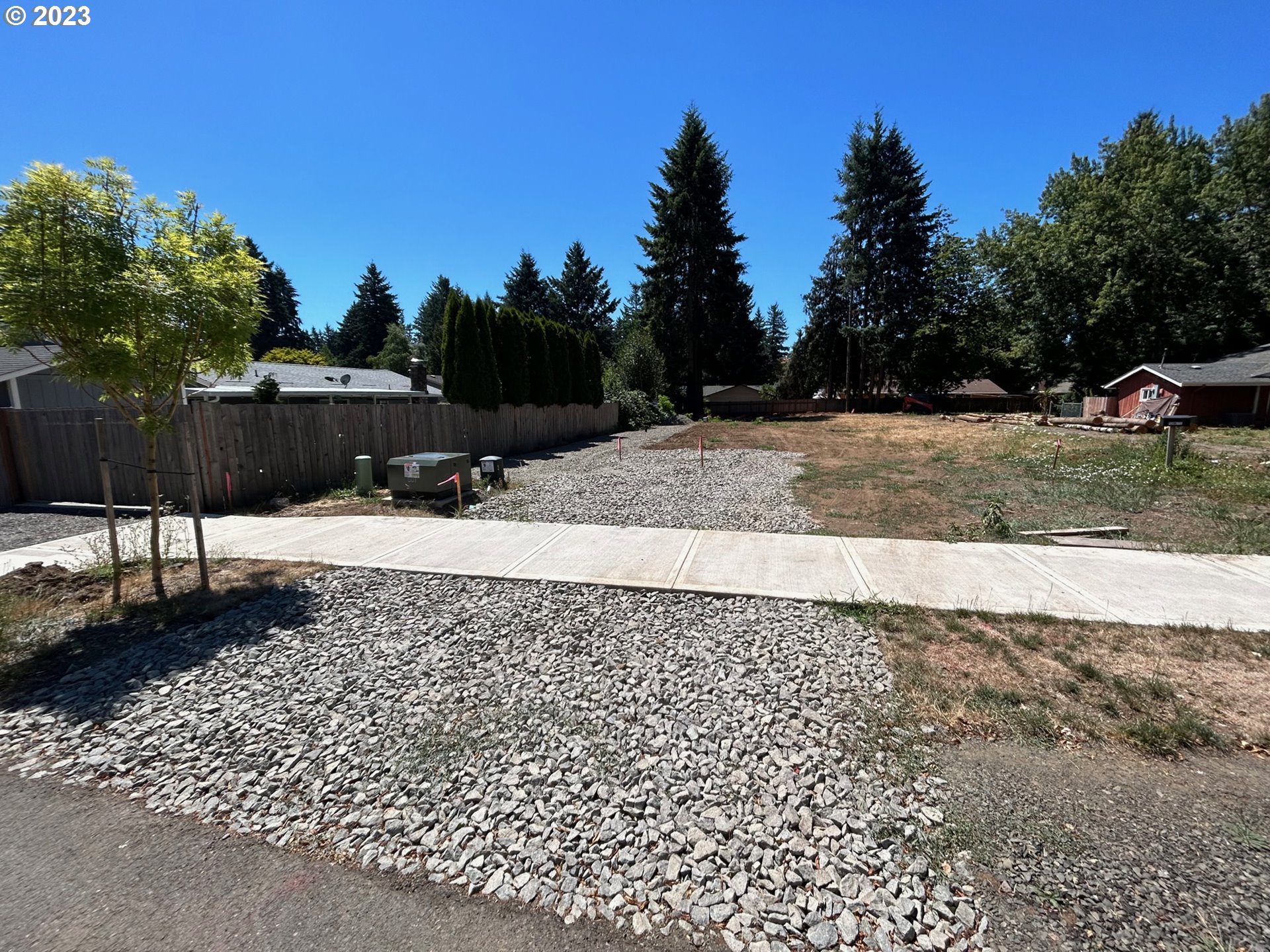 a view of a yard with a bench