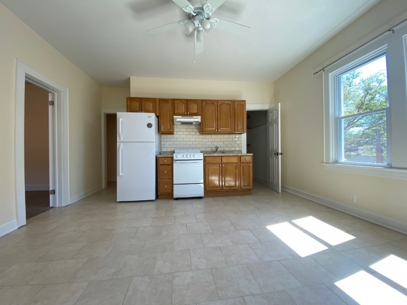 a view of kitchen with furniture and window