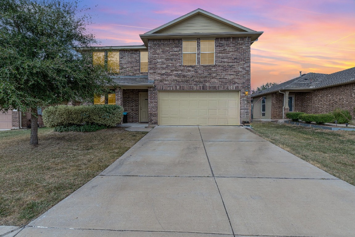 a front view of a house with yard