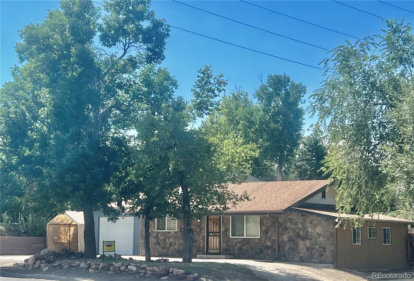 a view of a house with a tree