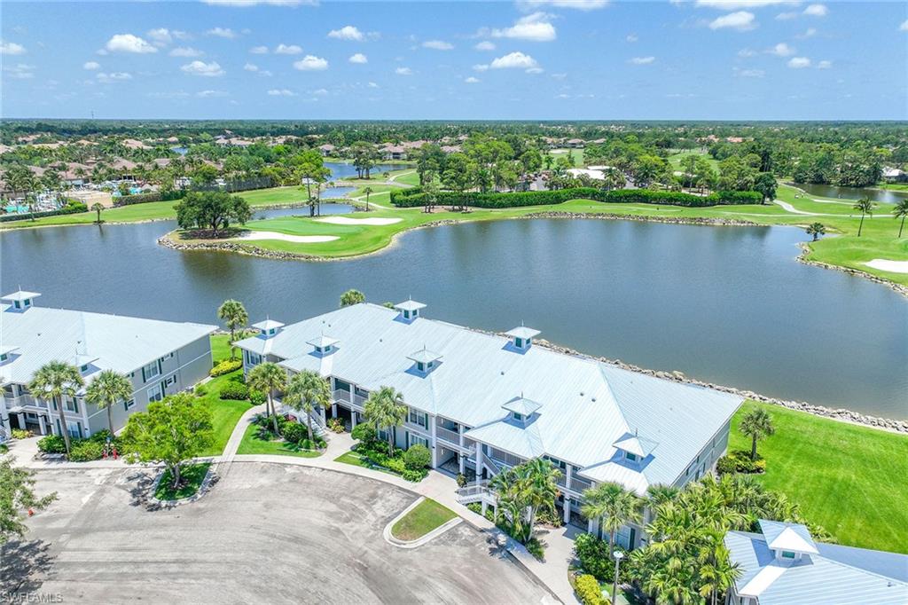 an aerial view of a house with a lake view