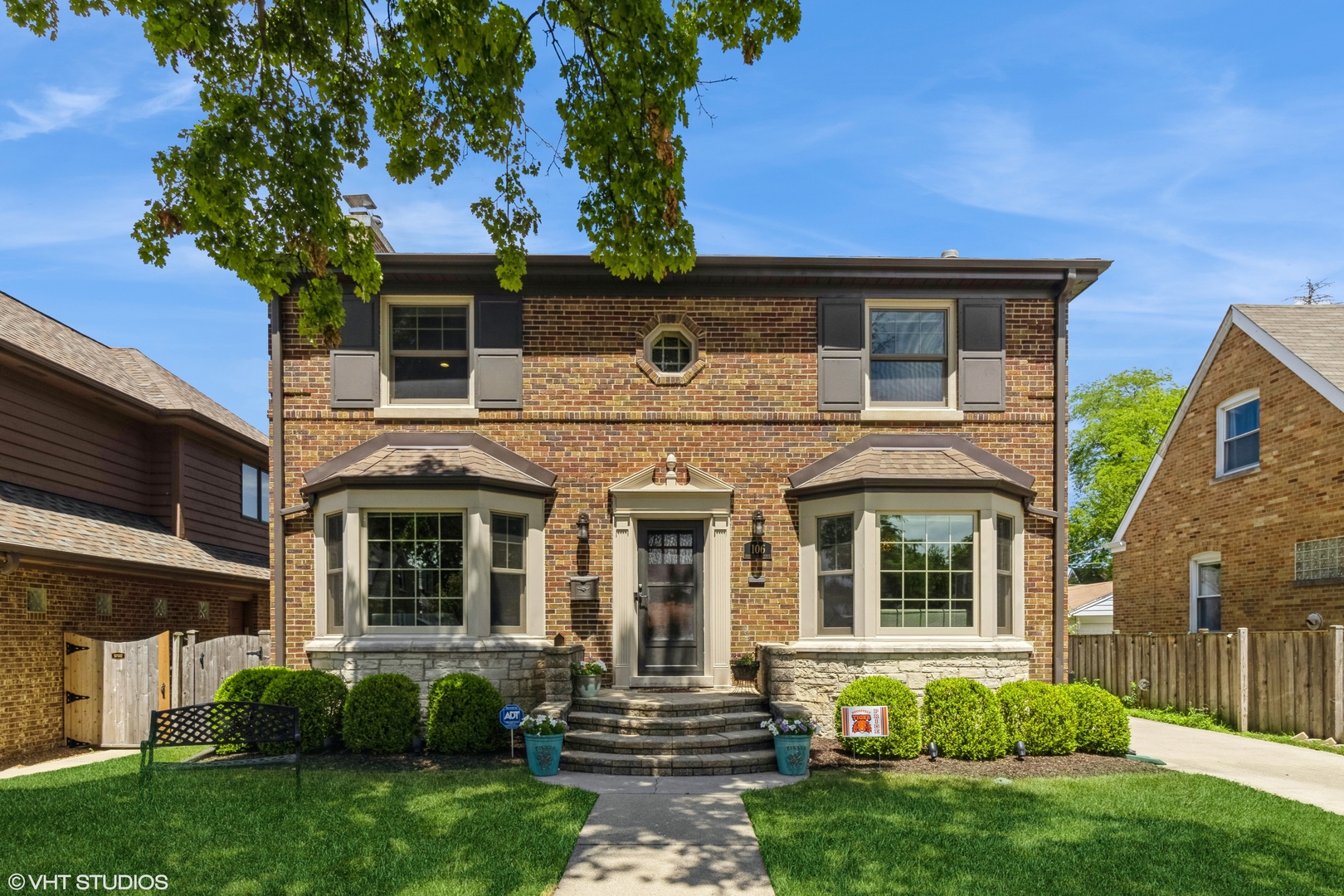 a front view of a house with garden