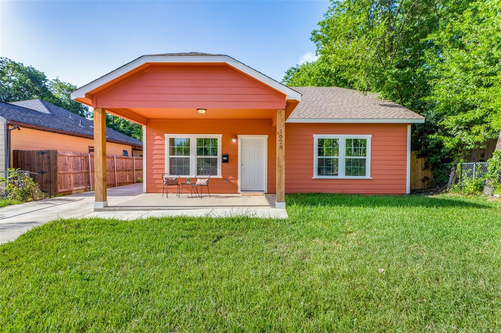 front view of a house with a yard