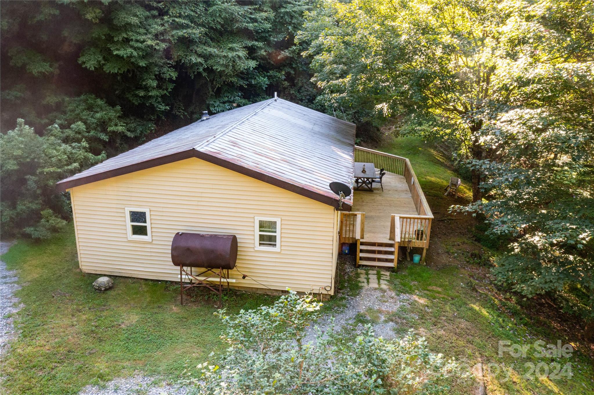 a backyard of a house with lots of green space