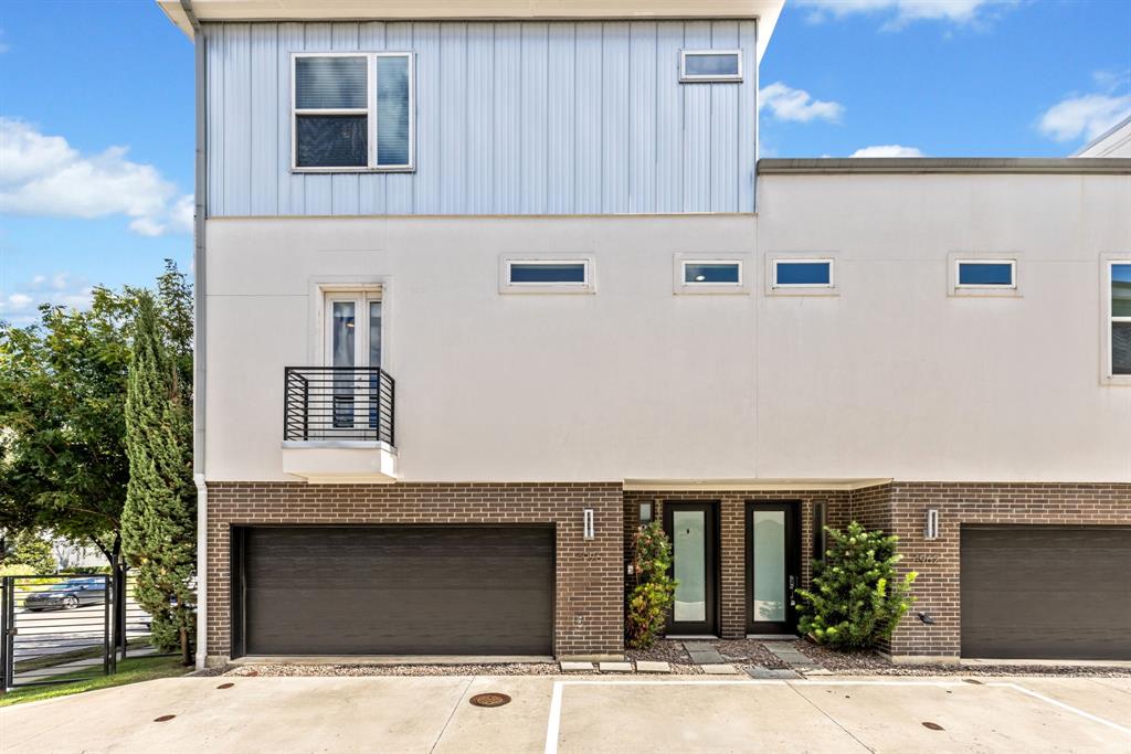 a front view of a house with garage