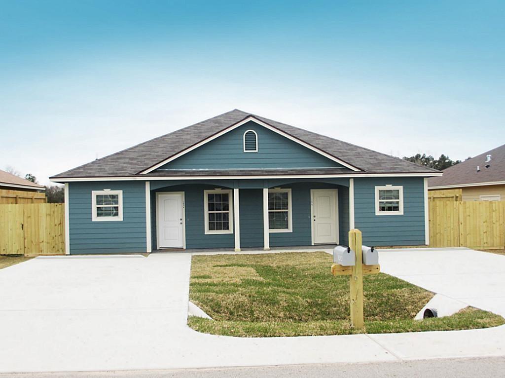 a front view of a house with yard