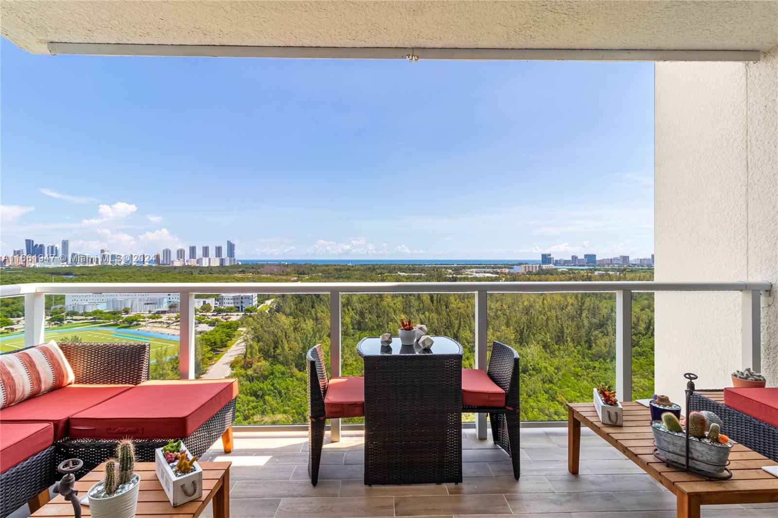 a balcony with an outdoor seating space