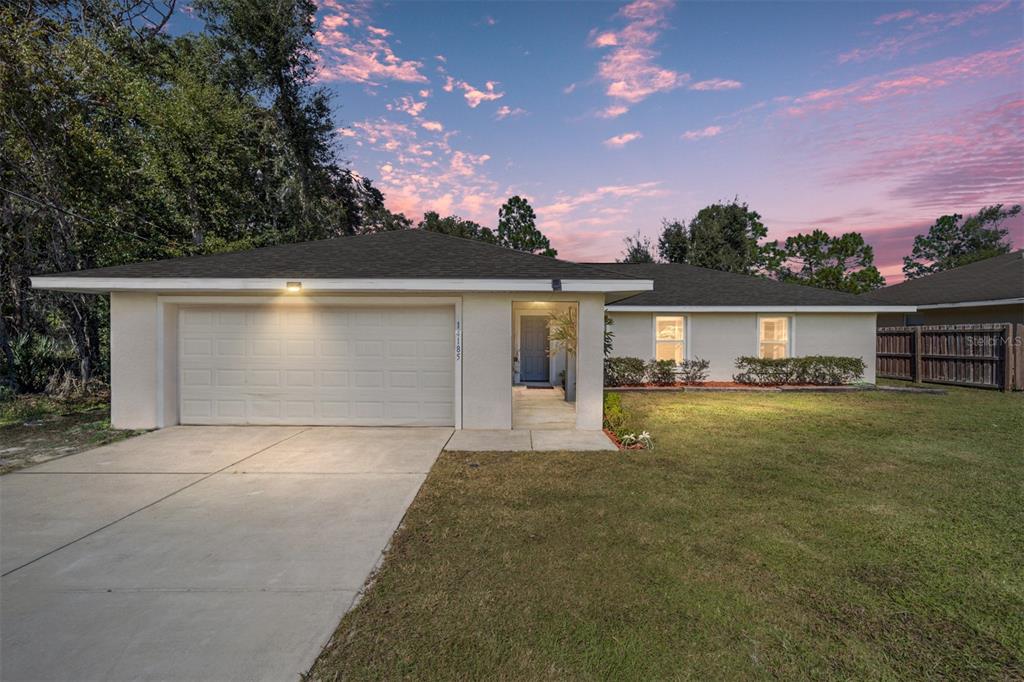 front view of a house with a yard