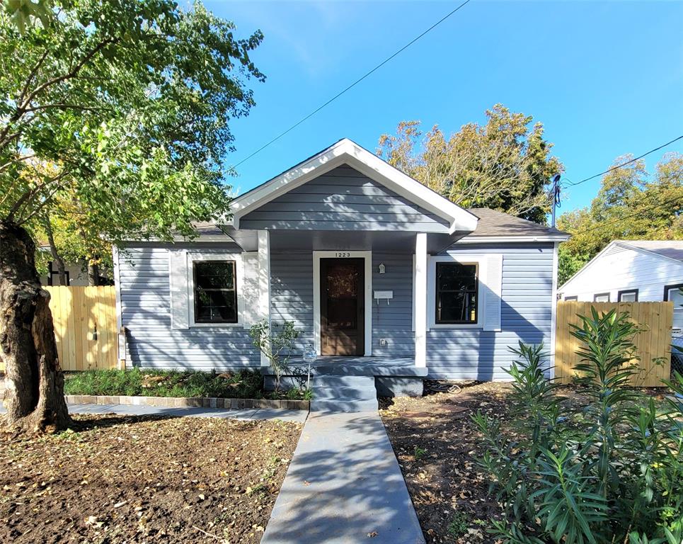 a front view of a house with yard