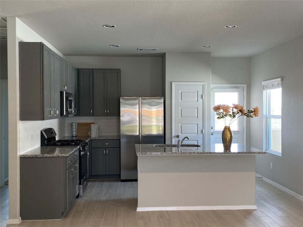 a view of a kitchen with a sink