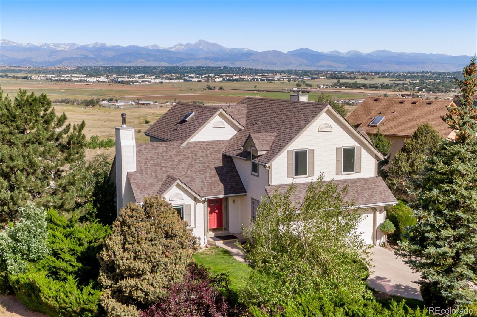 an aerial view of a house with a lake view