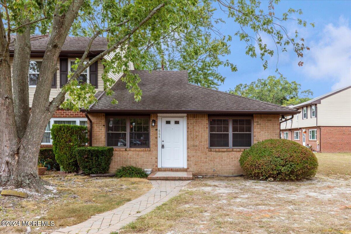 a house with a tree in front of it