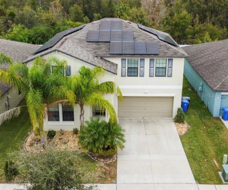 a aerial view of a house with a yard