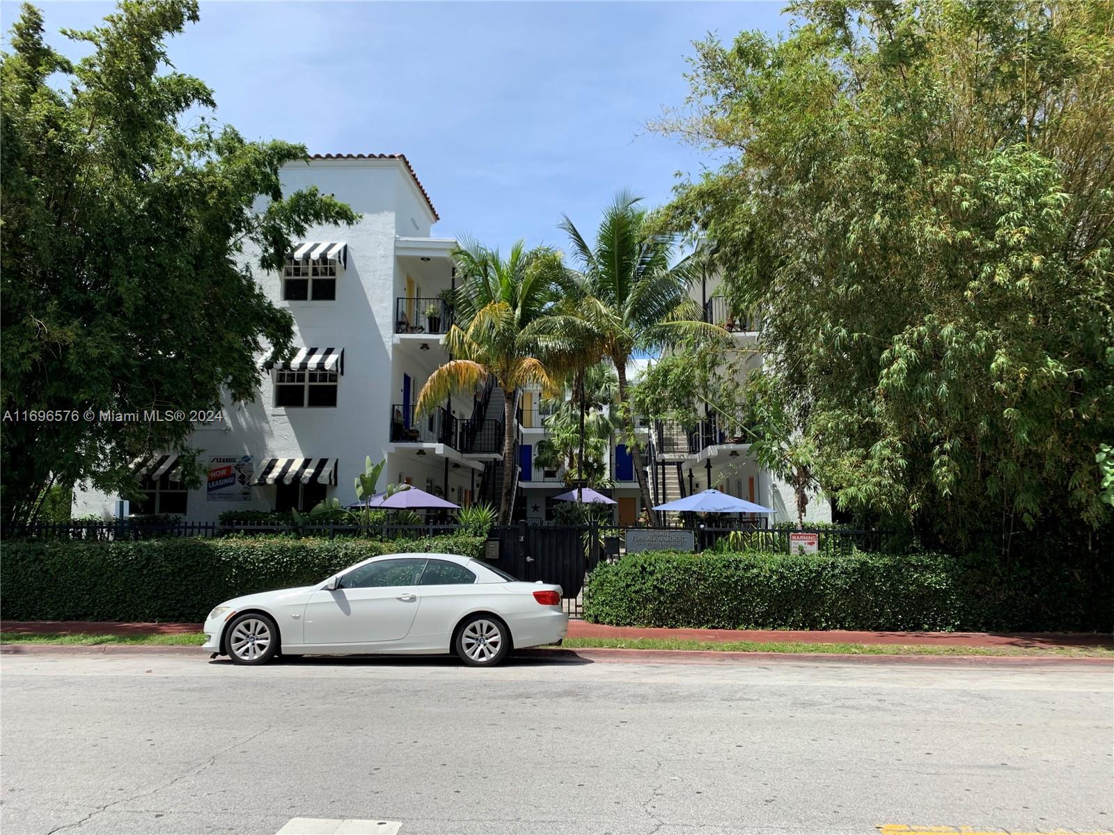 a view of a cars parked in front of a house