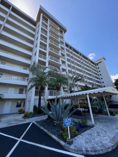 a front view of a building with sitting area