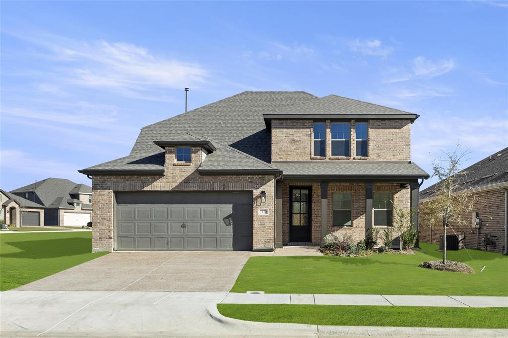 a front view of a house with a yard porch and outdoor seating