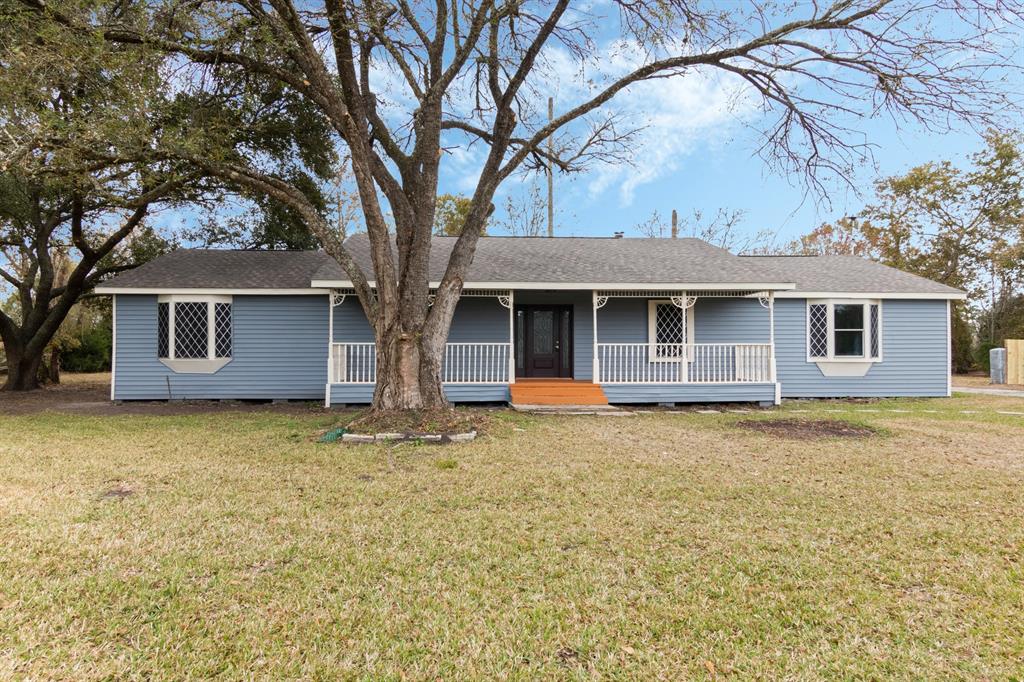 a house that has a tree in front of the house