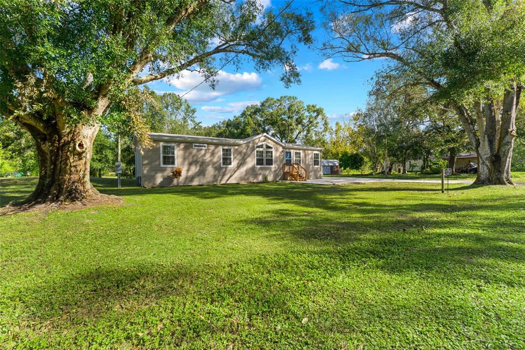 a view of a house with a big yard