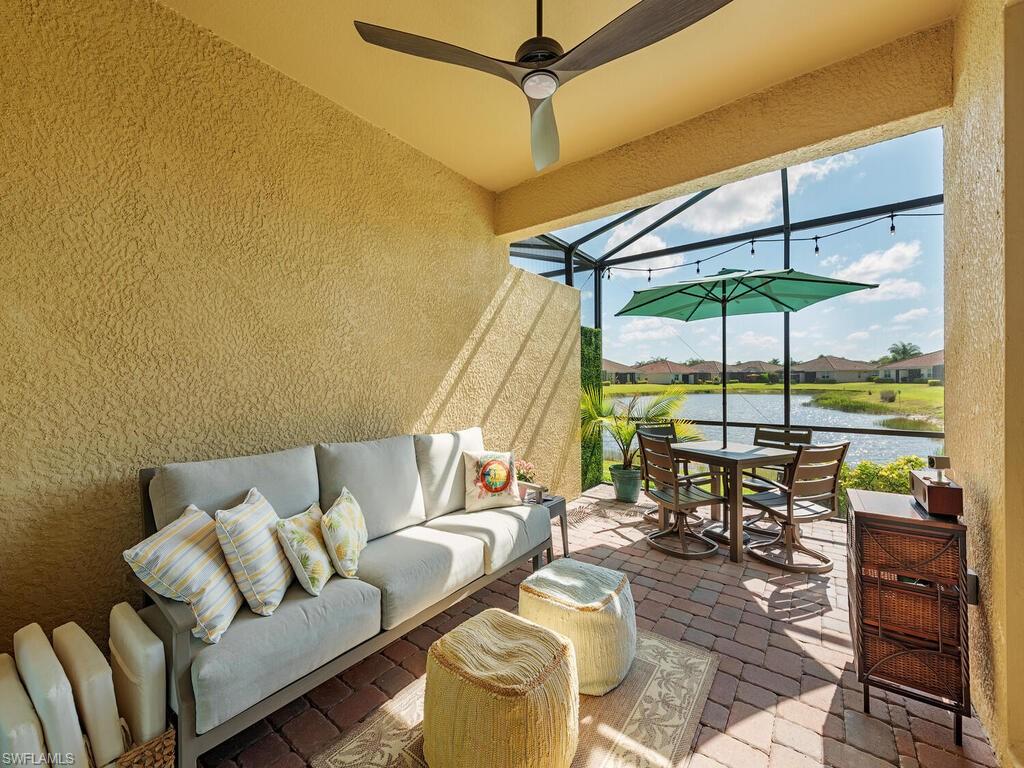 a living room with furniture a patio and a glass door