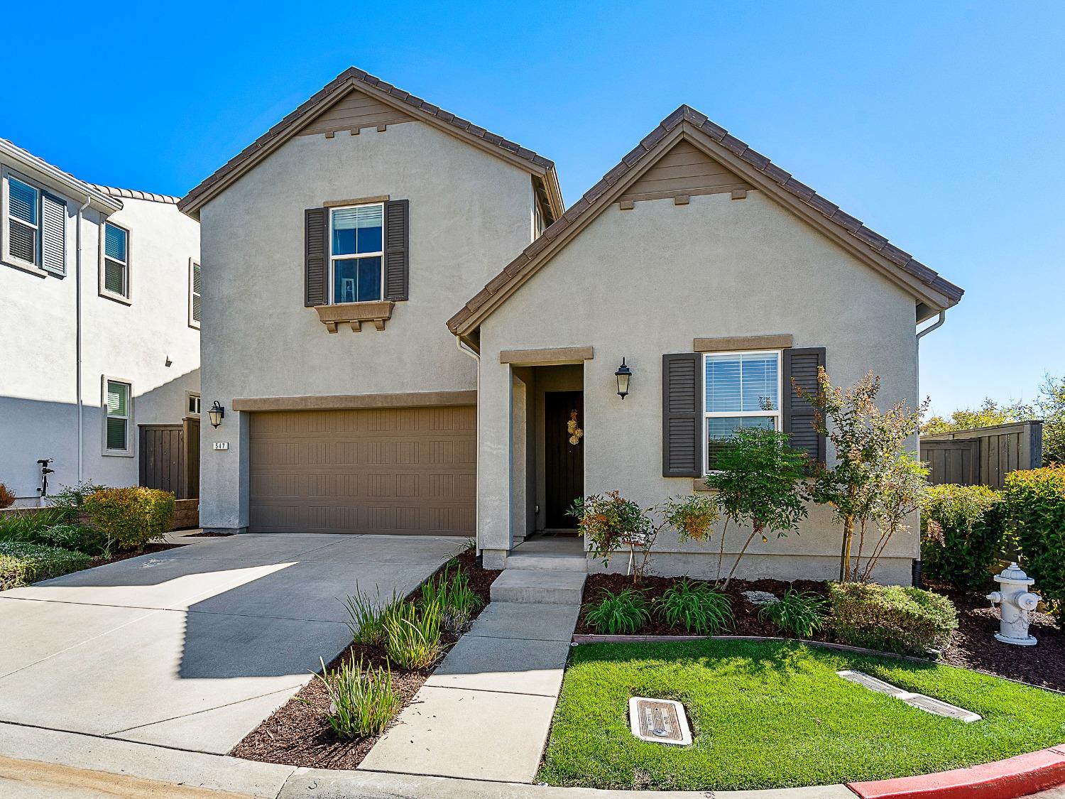 a front view of a house with a yard