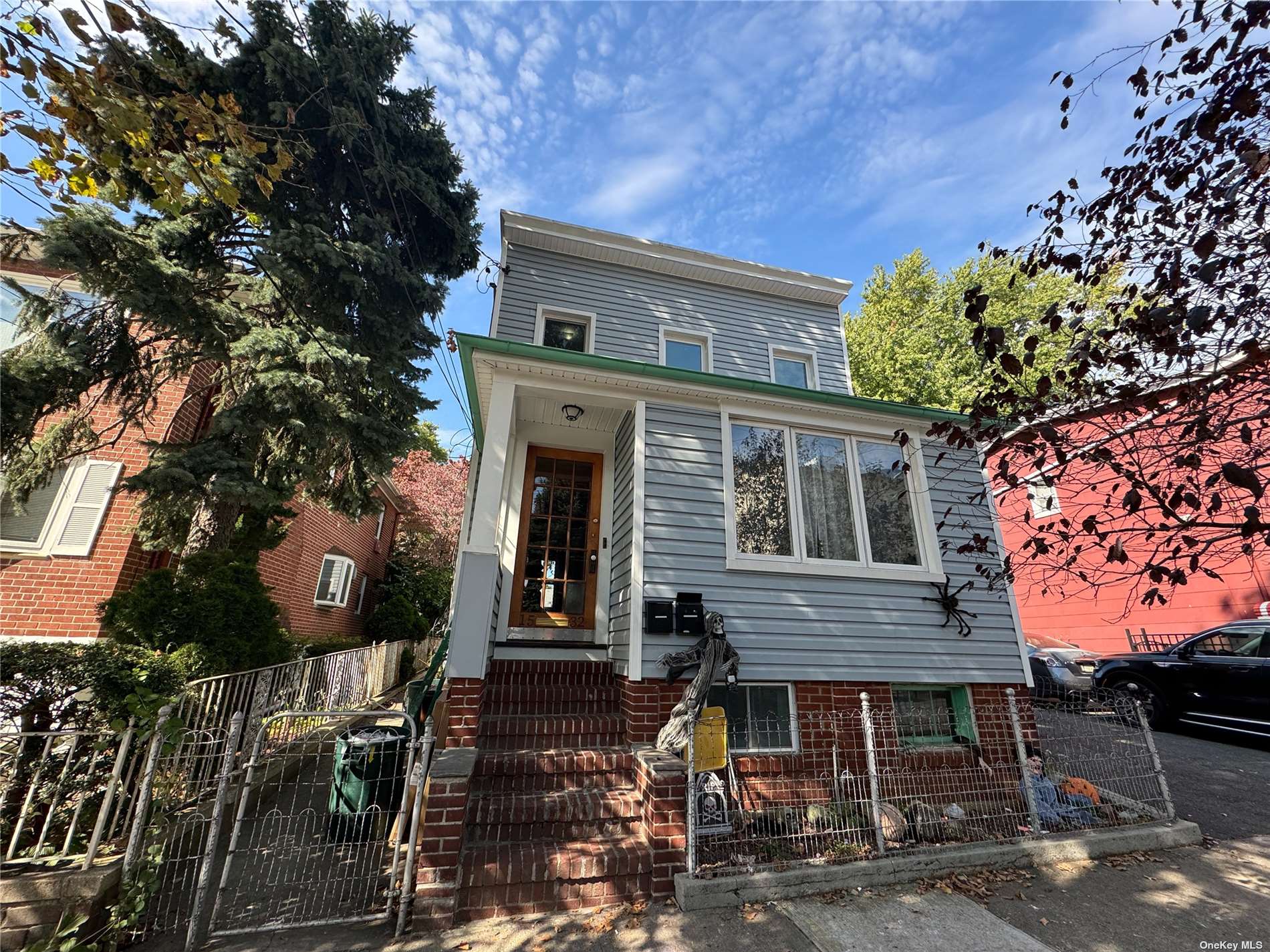 front view of a house with a tree