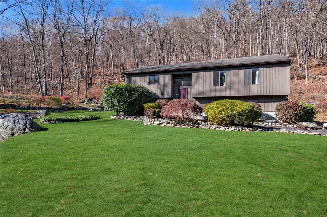 View of front of property featuring a front lawn