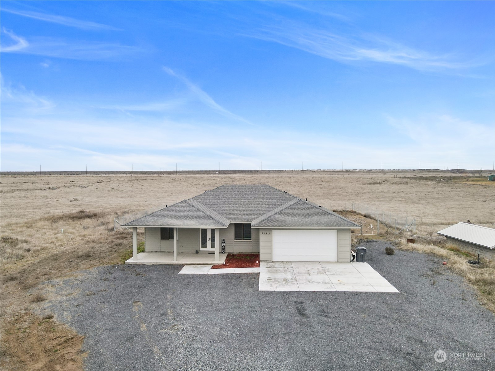 an aerial view of a house with beach and ocean view