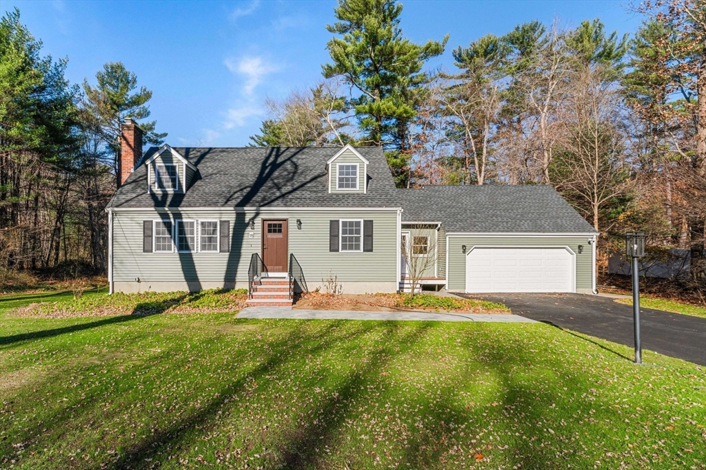 a house view with a sitting space and garden