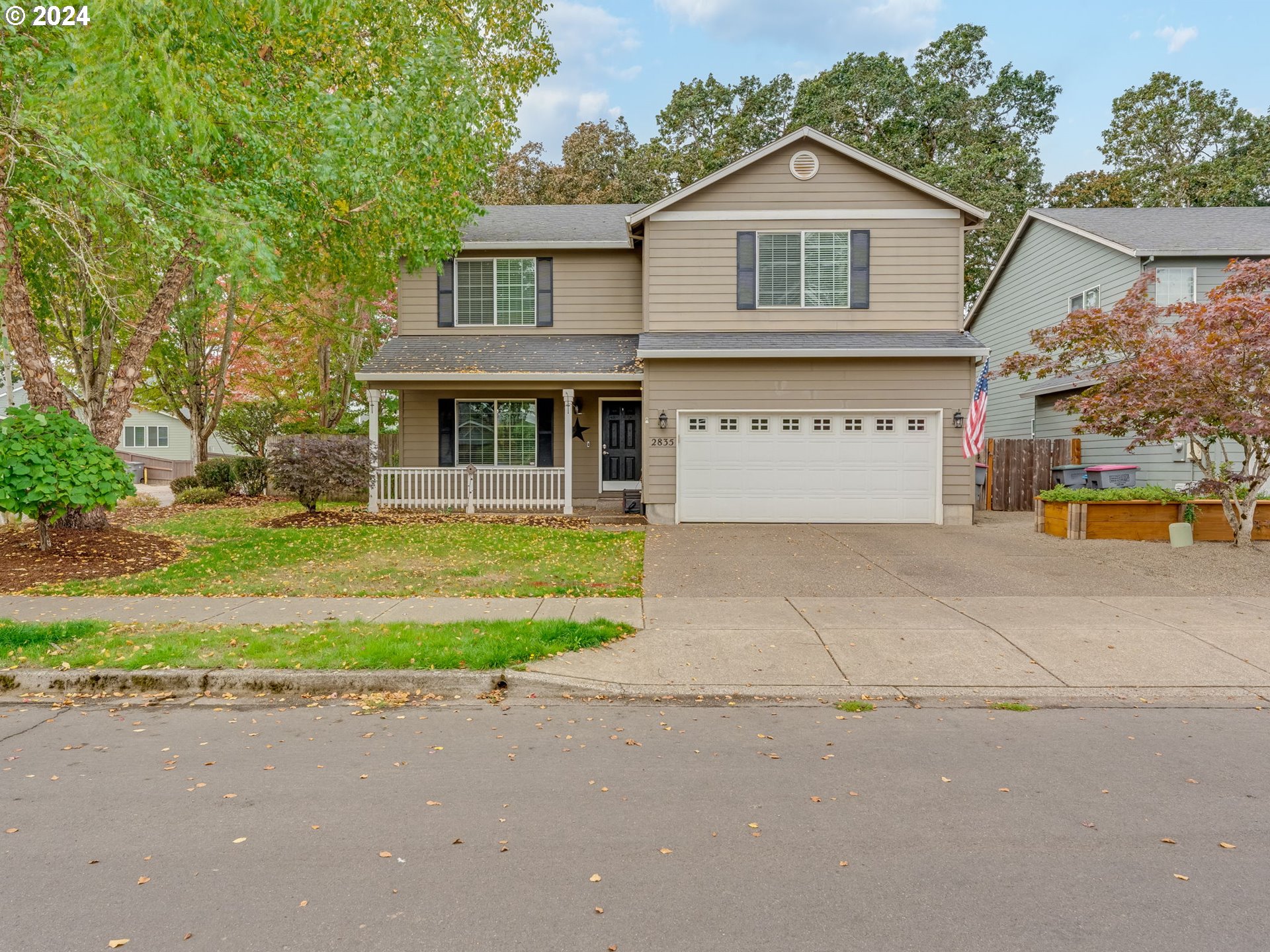 a front view of a house with garden