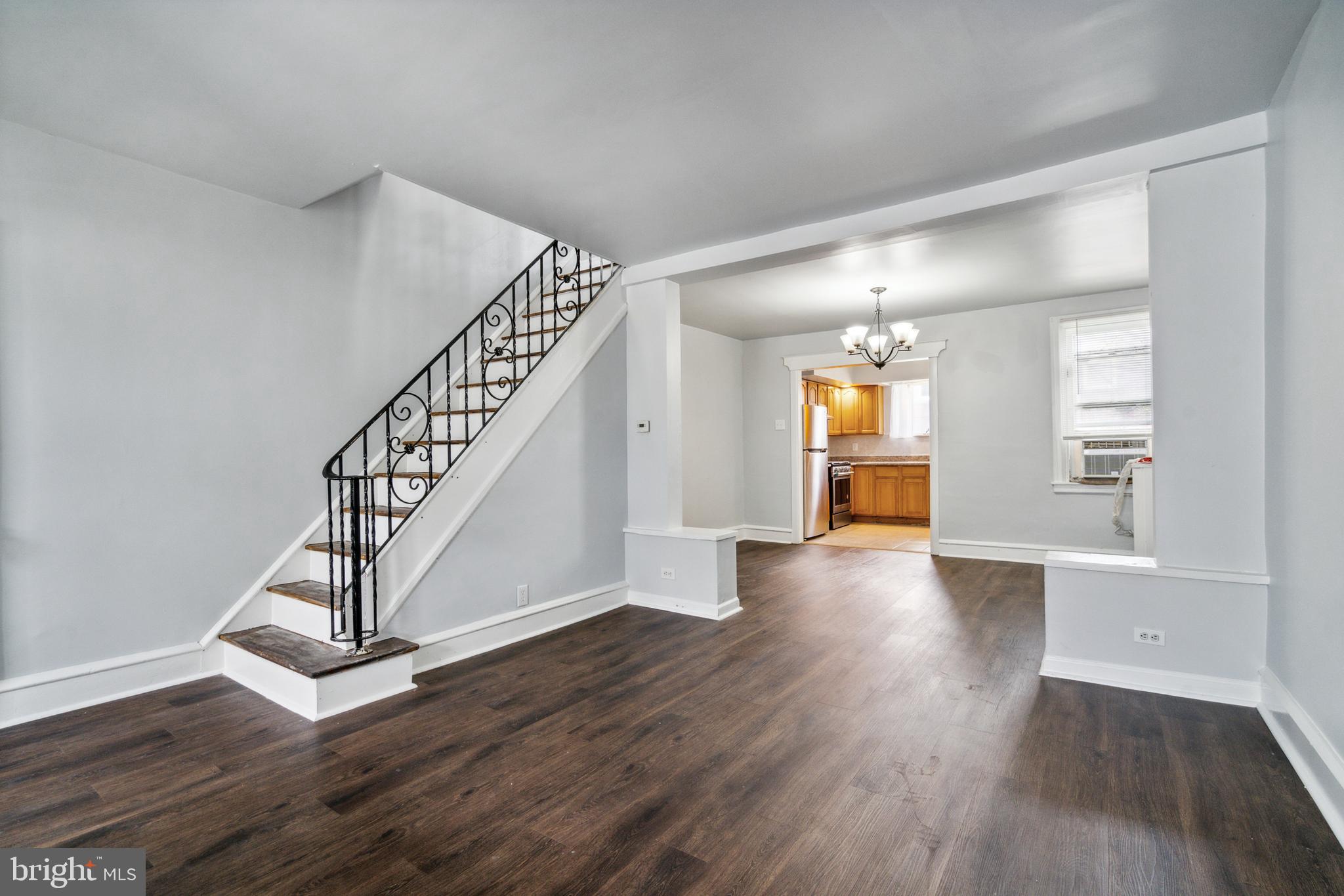 a view of an entryway with wooden floor