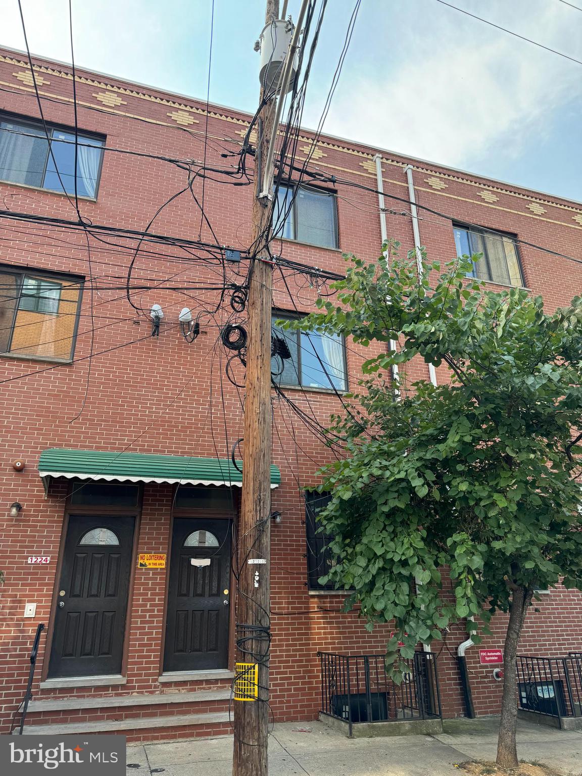 a view of a building with a tree