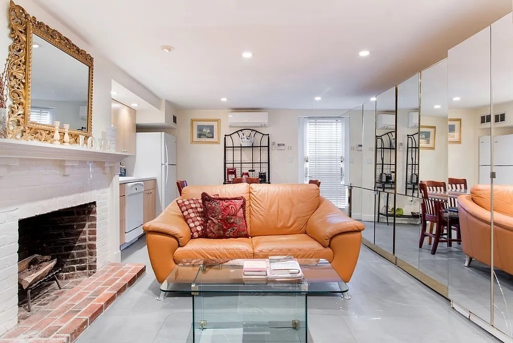 a view of a livingroom with furniture and a fireplace