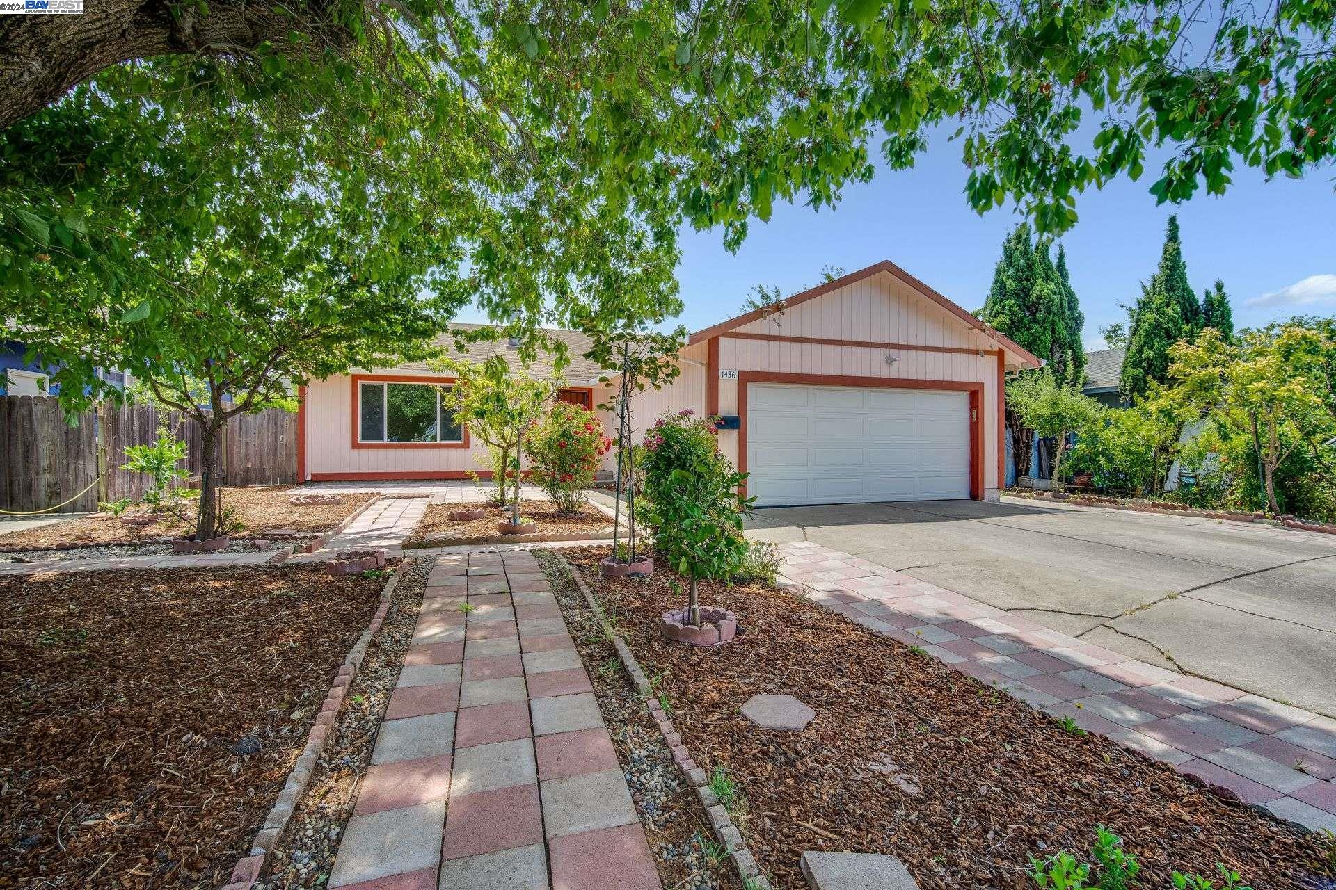 a front view of a house with yard