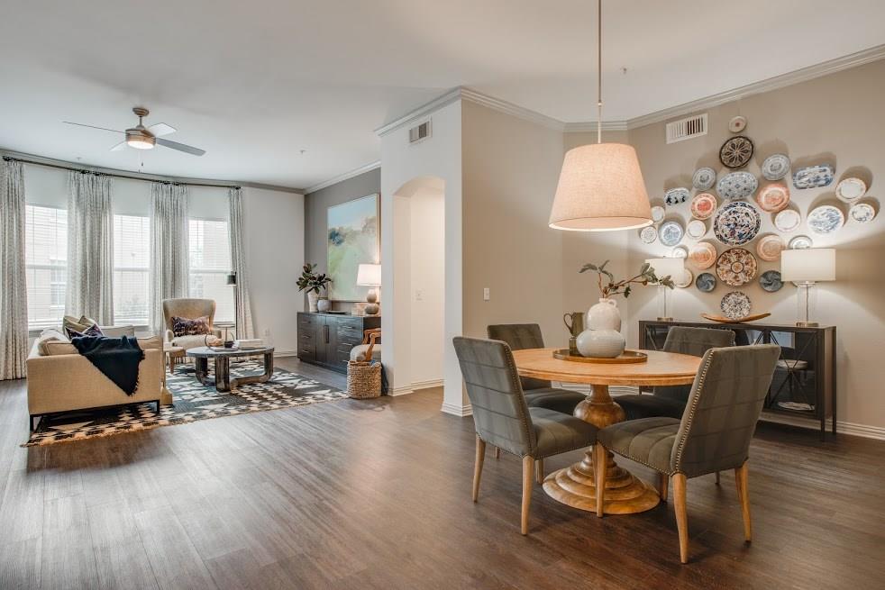 a view of a dining room with furniture window and wooden floor