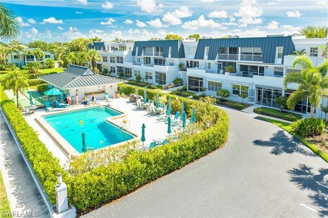 a view of a swimming pool with a patio