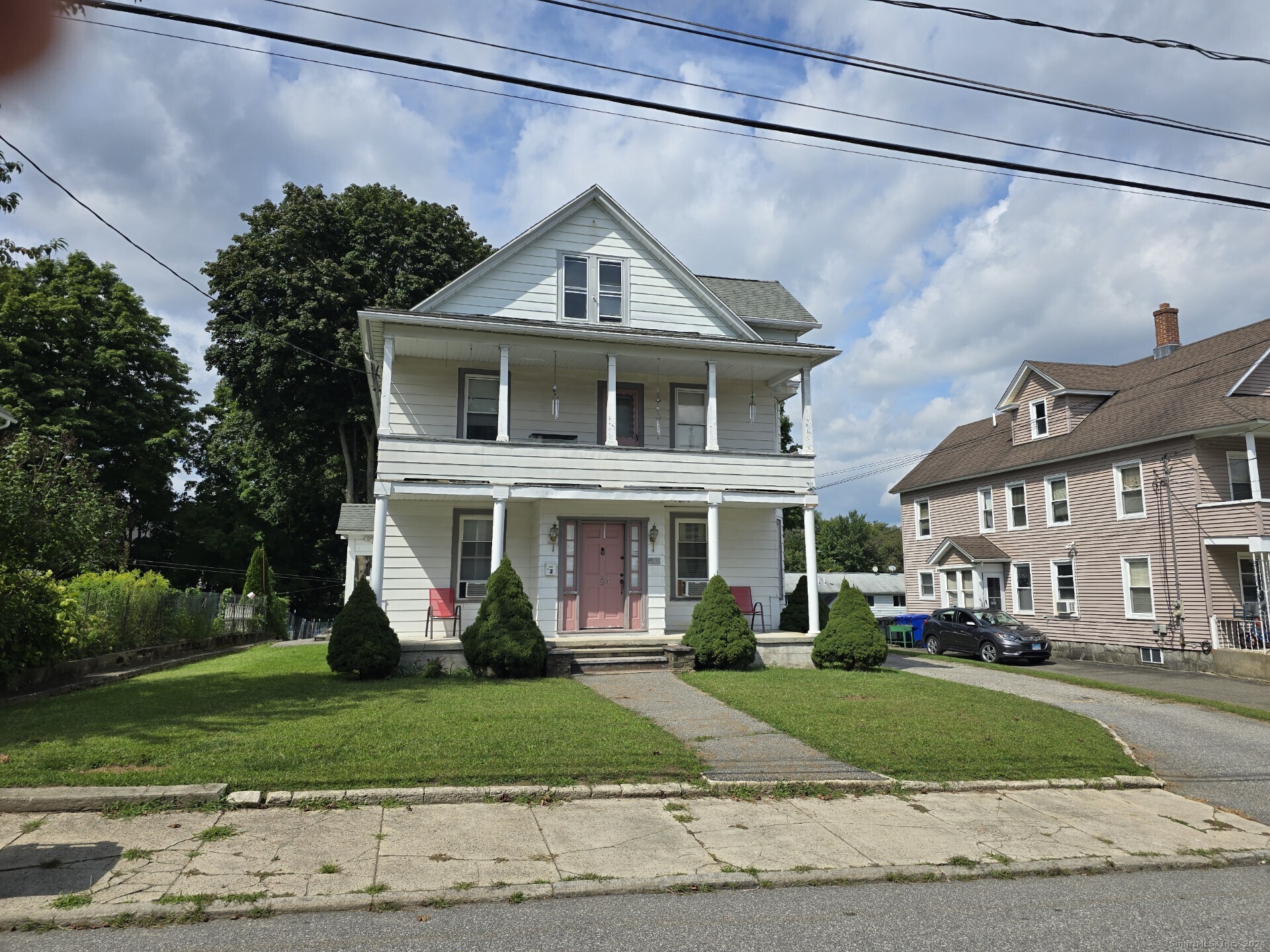 a front view of a house with a yard