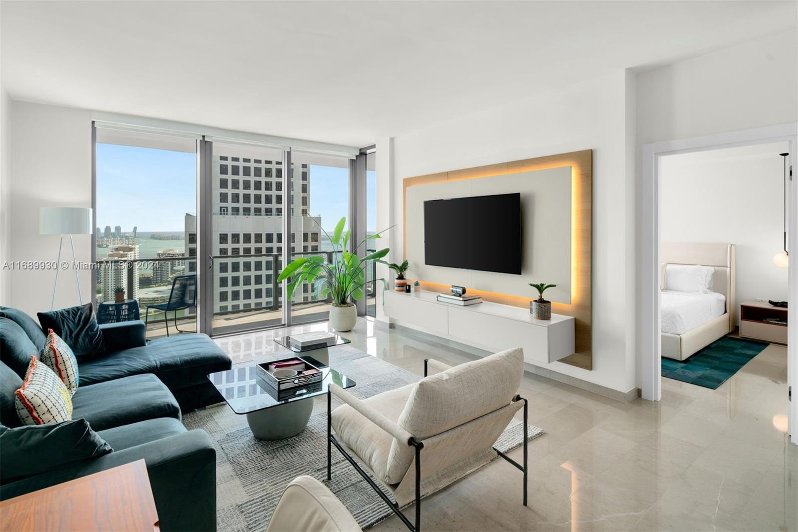 a living room with furniture and a flat screen tv