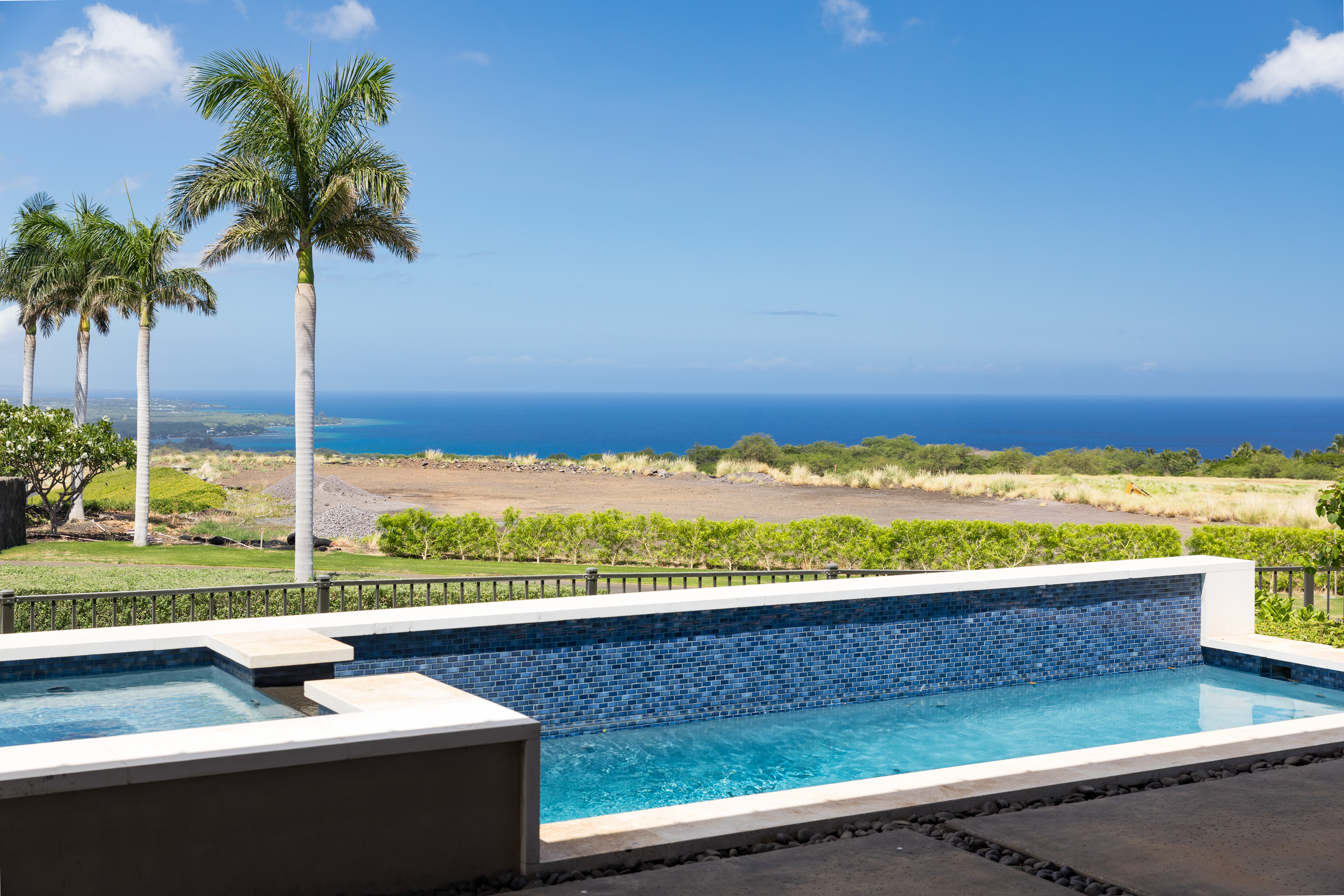 a view of outdoor space with seating area and ocean view