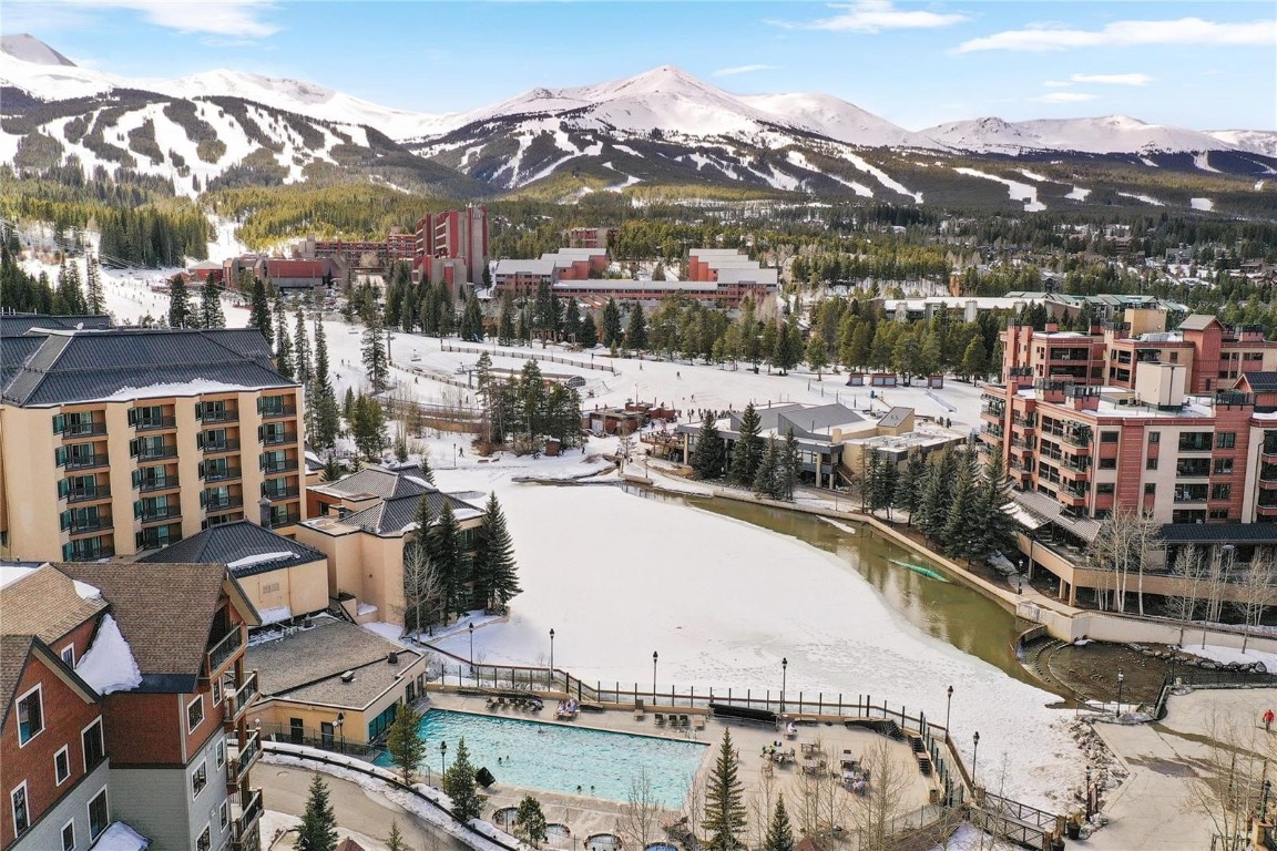 Snowy aerial view featuring a mountain view