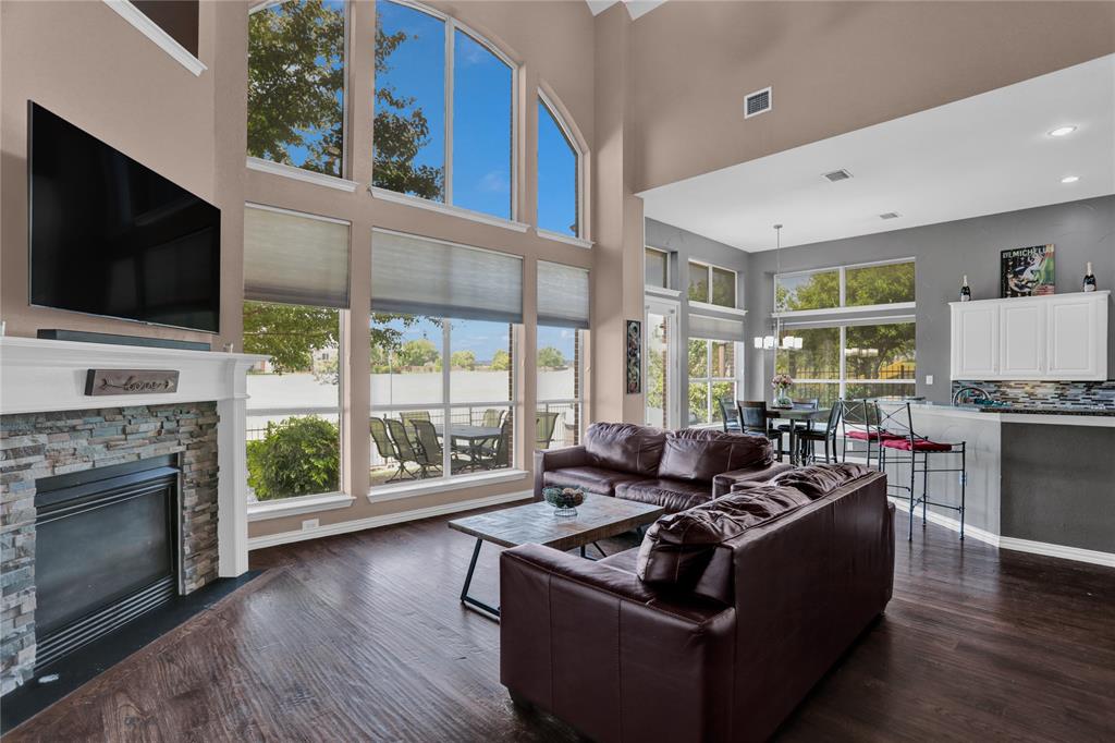 a living room with furniture fireplace and flat screen tv