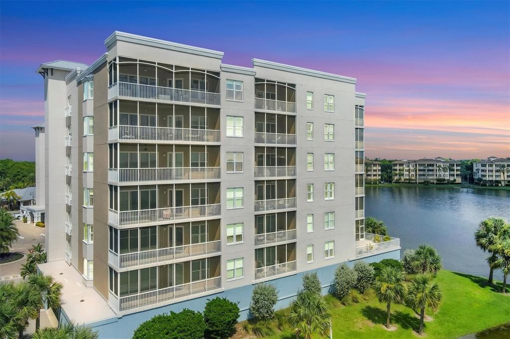 a front view of a building with a lake view