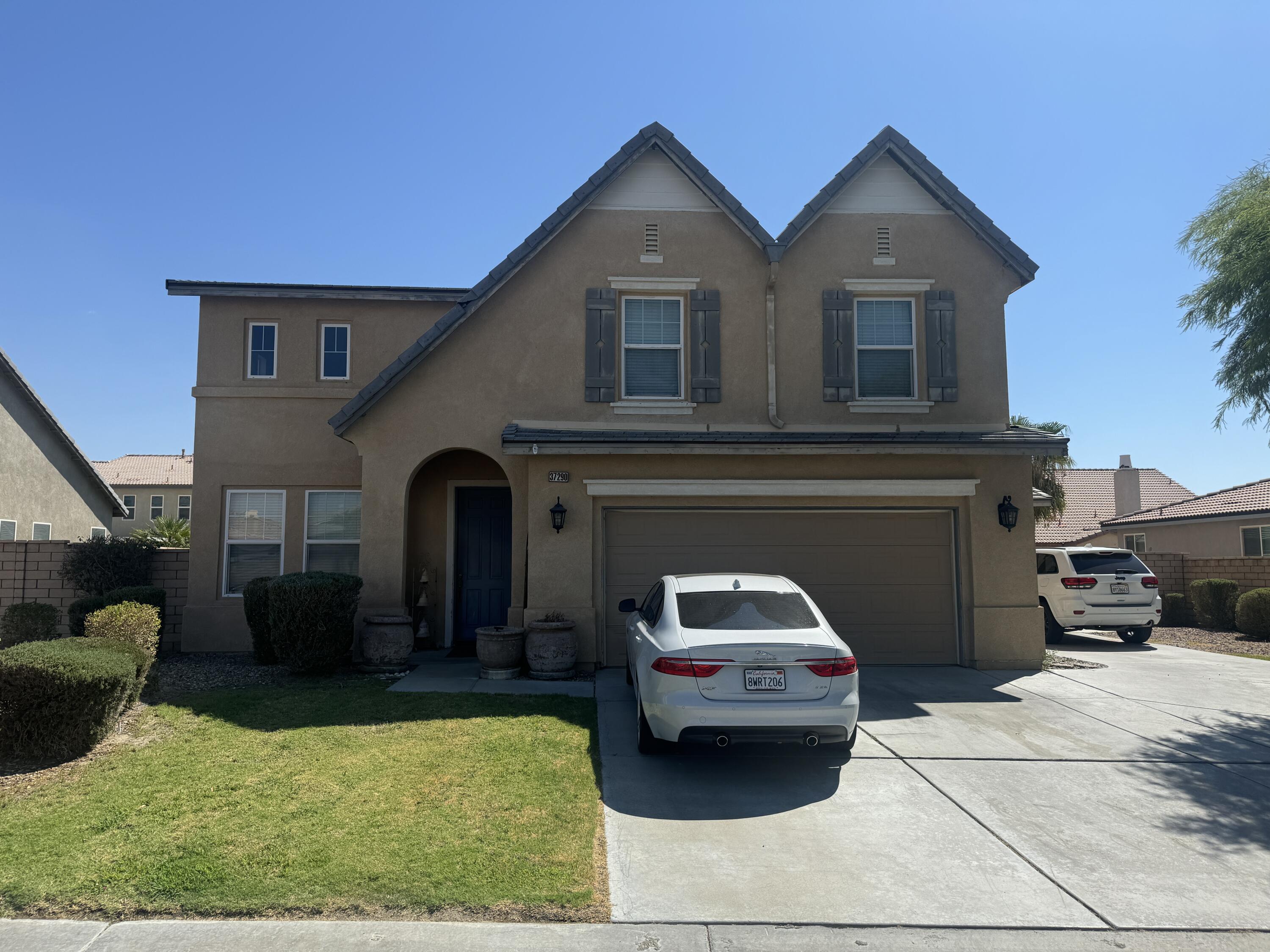 a view of a car in front of house