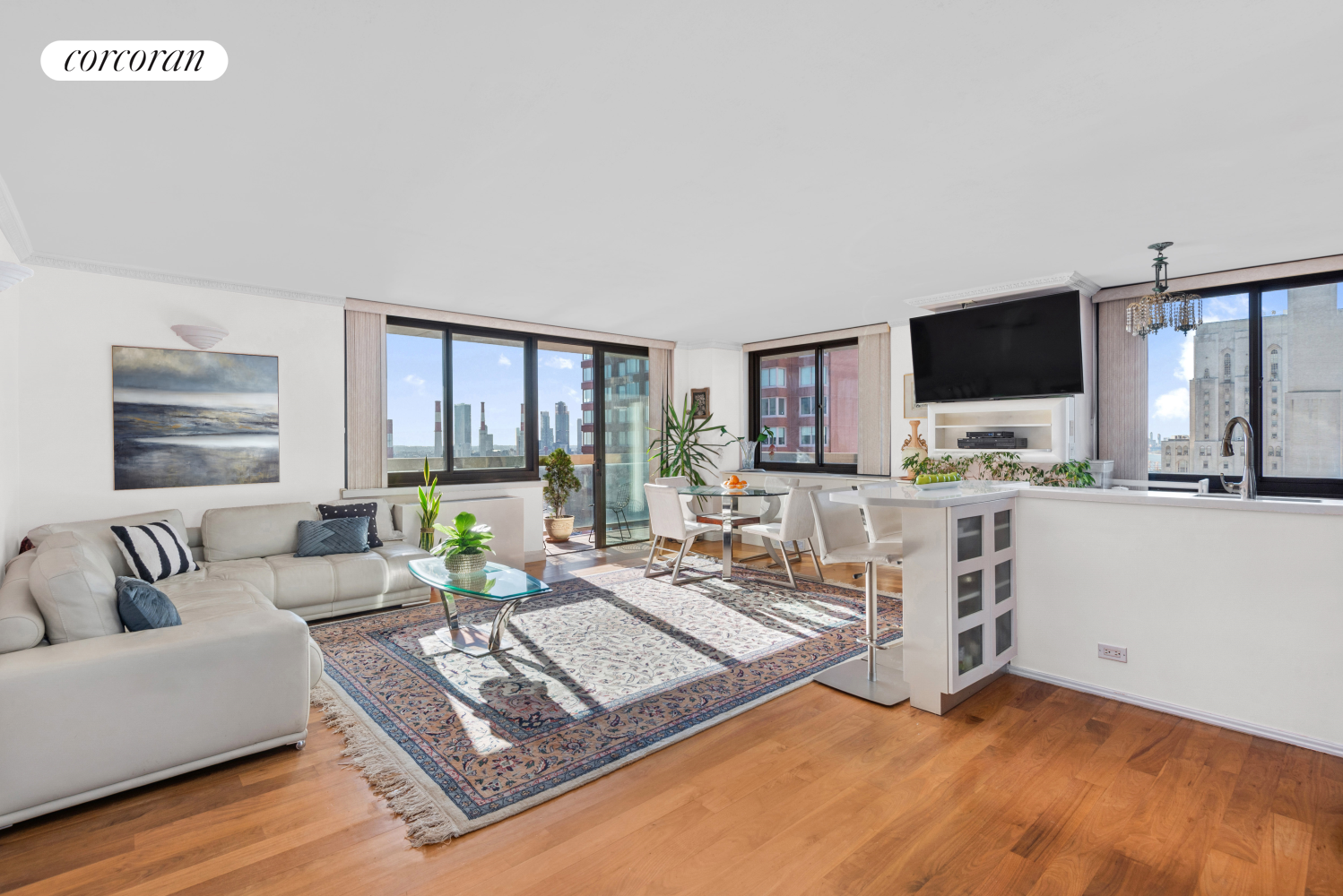 a living room with furniture and a flat screen tv