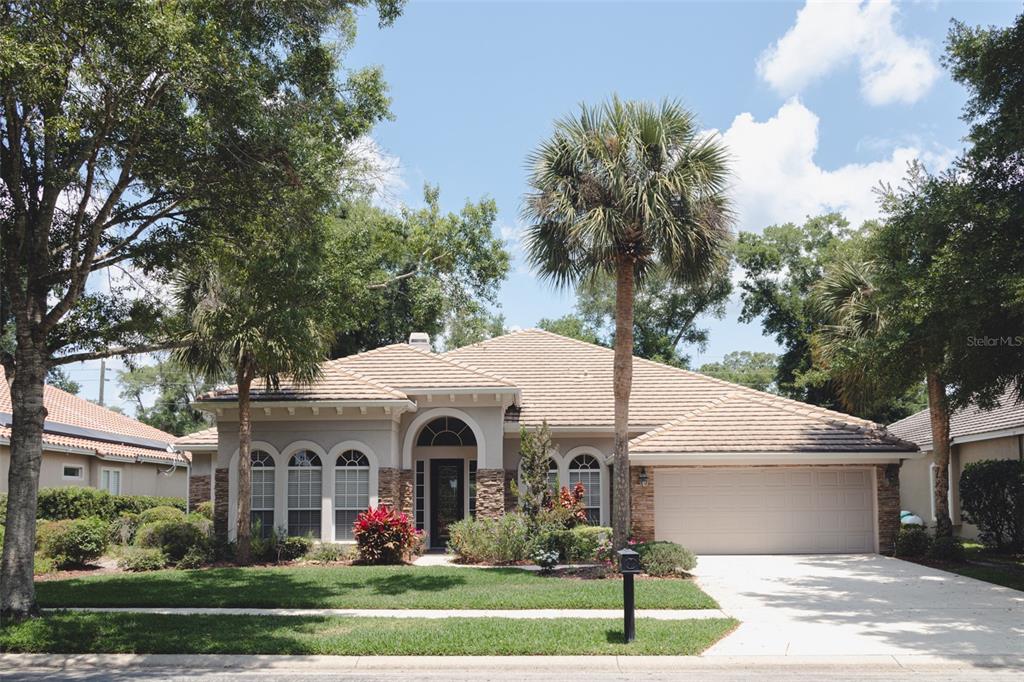 a front view of a house with garden