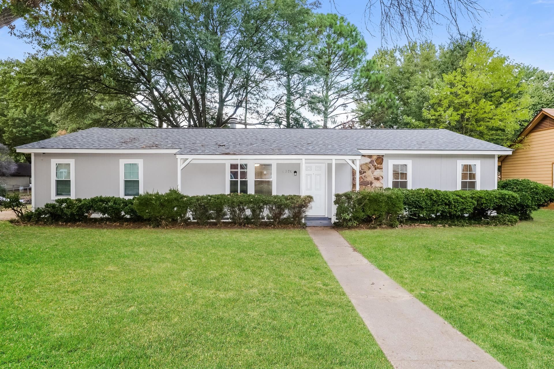 Ranch-style home with a front yard