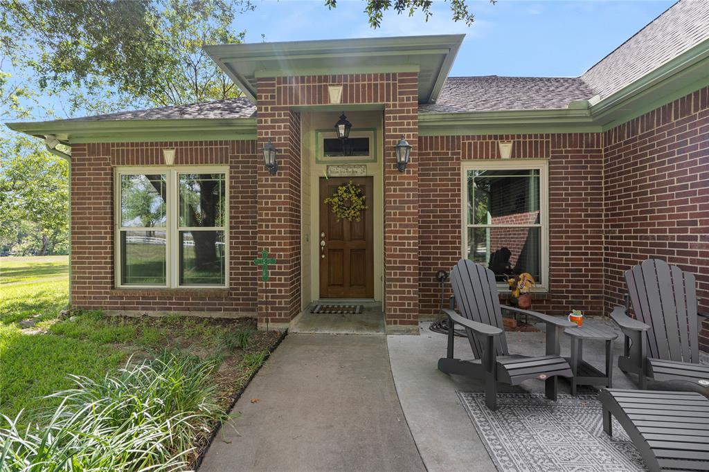 a front view of a house with outdoor seating